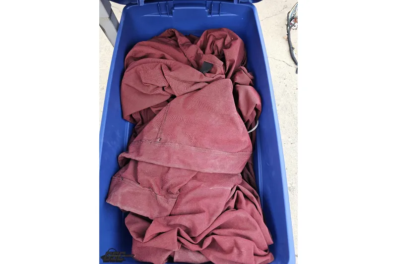 Slide: The Image of Blue container with red fabric inside, associated with Black Thunder 460, 2004 model. - 14