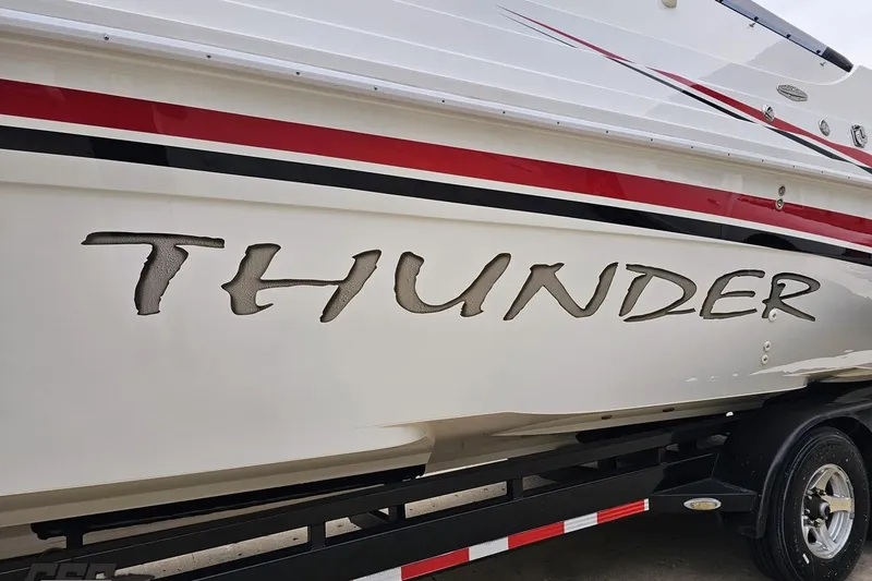 Slide: The Image of 2004 Black Thunder 460 boat with bold "Thunder" lettering and sleek red, black, and white design. - 18