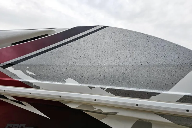 Slide: The Image of Close-up of 2004 Black Thunder 460 boat hull with sleek, modern design and water droplets. - 24