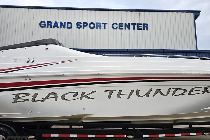 Slide: The Image of 2004 Black Thunder 460 boat at Grand Sport Center, featuring sleek design and bold graphics. - 3