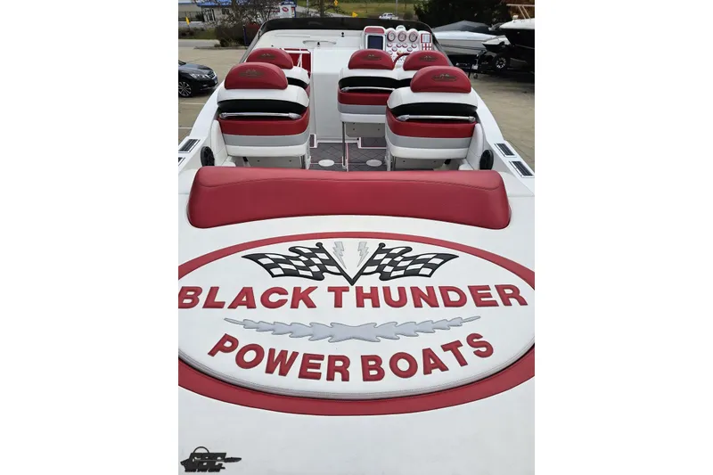 Slide: The Image of 2004 Black Thunder 460 powerboat interior with red and white seating, logo visible. - 37