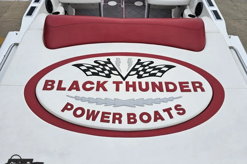 Slide: The Image of 2004 Black Thunder 460 power boat logo with red and white design. - 38