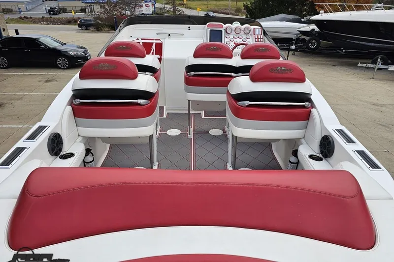 Slide: The Image of 2004 Black Thunder 460 boat interior with red and white seating, dashboard view. - 40
