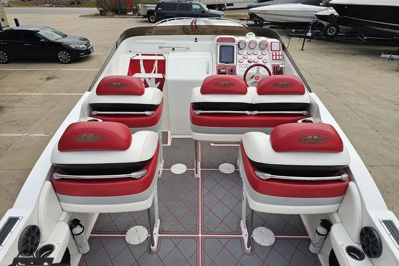 Slide: The Image of 2004 Black Thunder 460 boat interior with red and white seating, dashboard, and controls. - 41