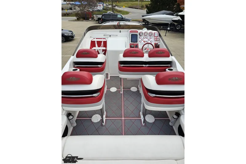 Slide: The Image of Interior of a 2004 Black Thunder 460 boat with red and white seating. - 42