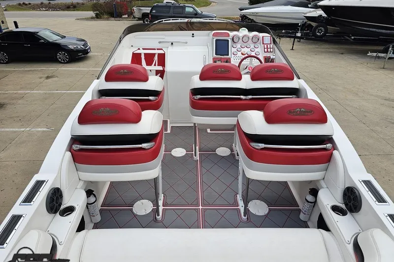 Slide: The Image of Interior of 2004 Black Thunder 460 boat with red and white seating. - 43