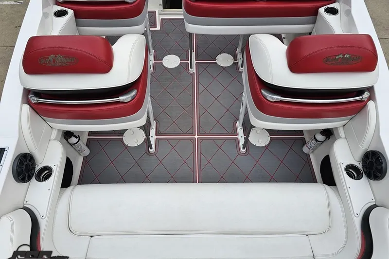 Slide: The Image of Interior of 2004 Black Thunder 460 boat with red and white seating. - 44