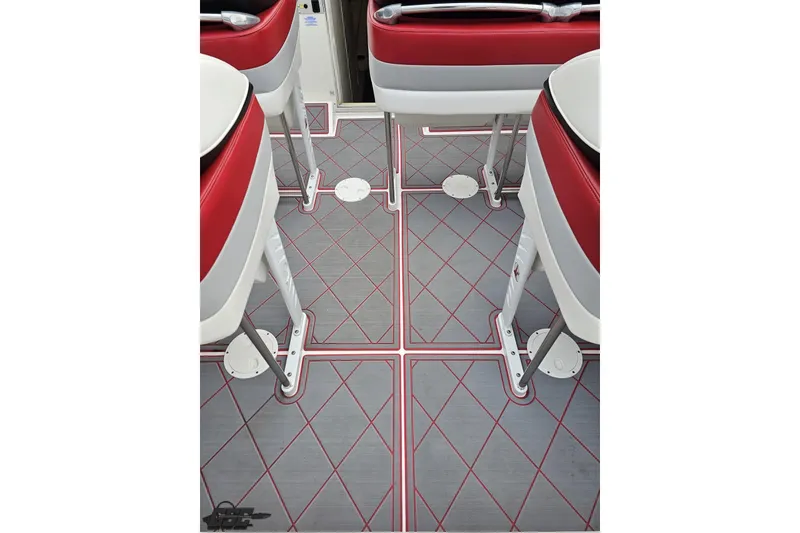 Slide: The Image of Interior of 2004 Black Thunder 460 boat with red and gray seating and flooring. - 45
