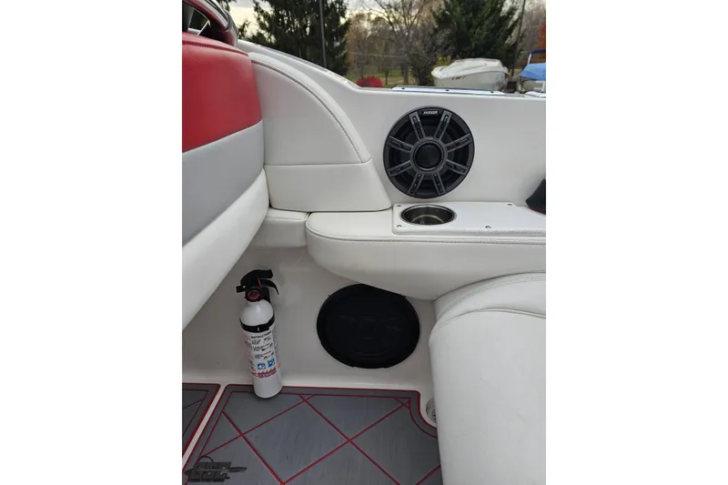 Slide: The Image of Interior of 2004 Black Thunder 460 boat with speaker, cup holder, and fire extinguisher. - 46