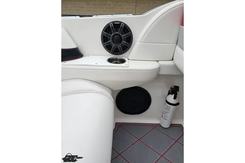 Slide: The Image of Interior of 2004 Black Thunder 460 boat with speaker, cup holder, and fire extinguisher. - 47