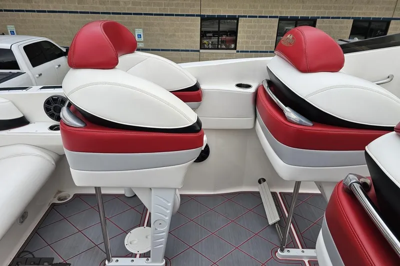 Slide: The Image of 2004 Black Thunder 460 boat interior with red and white seating, showcasing luxury design. - 48