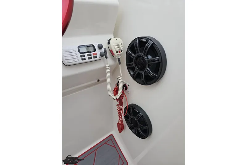 Slide: The Image of 2004 Black Thunder 460 boat interior with radio, speakers, and microphone. - 61