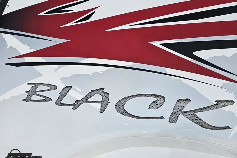 Slide: The Image of Black Thunder 460 boat graphic with bold red and black design, 2004 model. - 67