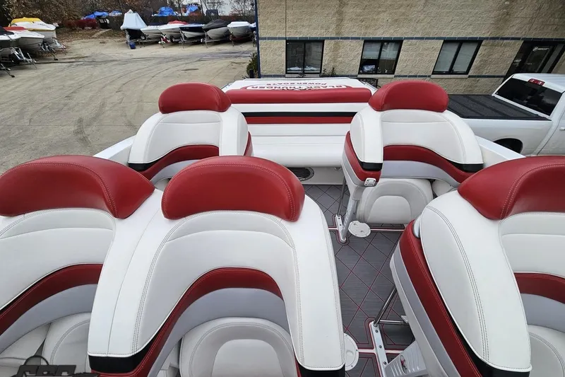 Slide: The Image of Luxury seating on a 2004 Black Thunder 460 boat, featuring red and white upholstery. - 69