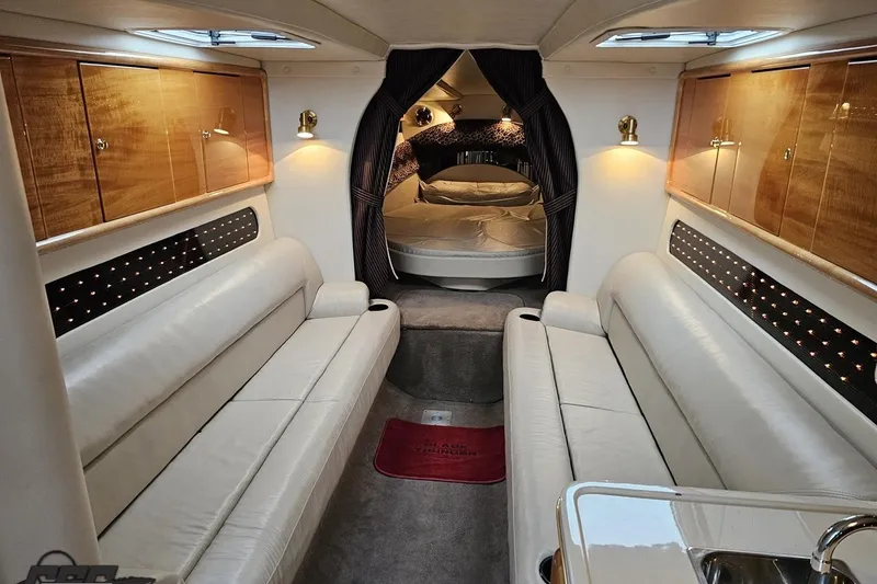 Slide: The Image of Luxurious interior of a 2004 Black Thunder 460 boat with elegant seating and cozy bedroom. - 73