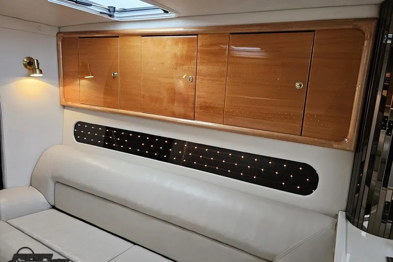 Slide: The Image of Luxurious interior of 2004 Black Thunder 460 boat with wooden cabinets and leather seating. - 82