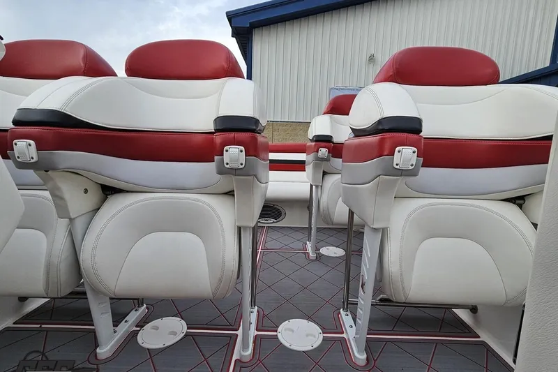 Slide: The Image of Luxury seating on a 2004 Black Thunder 460 boat, featuring red and white upholstery. - 94