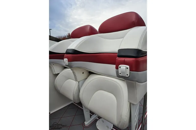 Slide: The Image of Luxury seating in a 2004 Black Thunder 460 boat, featuring red and white upholstery. - 97