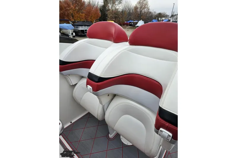 Slide: The Image of Red and white leather seats in a 2004 Black Thunder 460 boat. - 98