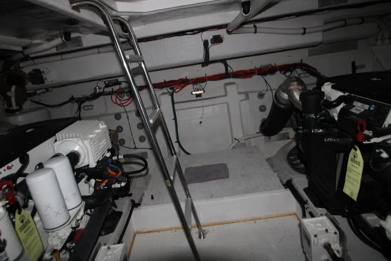 Slide: The Image of Engine room of 2019 Cruisers Yachts 42 Cantius with visible machinery and ladder. - 101