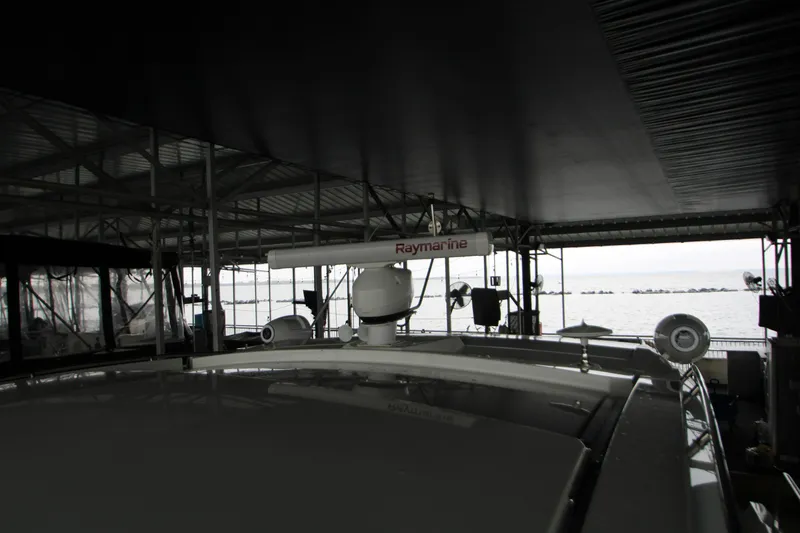 Slide: The Image of 2019 Cruisers Yachts 42 Cantius under covered dock with Raymarine equipment. - 103