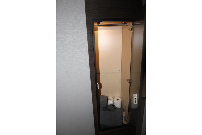 Slide: The Image of 2019 Cruisers Yachts 42 Cantius bathroom storage with towels and toiletries. - 25