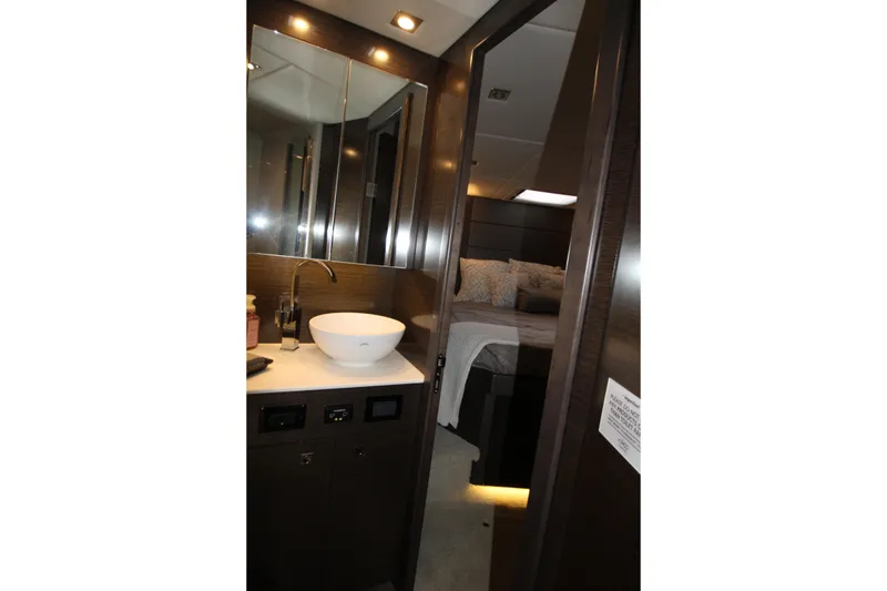 Slide: The Image of Luxurious interior of 2019 Cruisers Yachts 42 Cantius, featuring modern bathroom and cozy bedroom. - 31