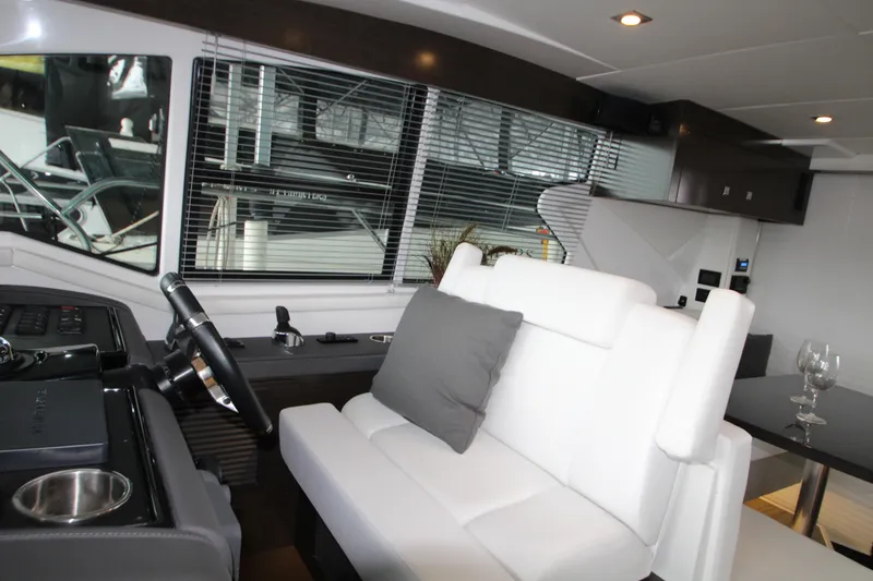 Slide: The Image of Interior of 2019 Cruisers Yachts 42 Cantius with modern seating and helm. - 49