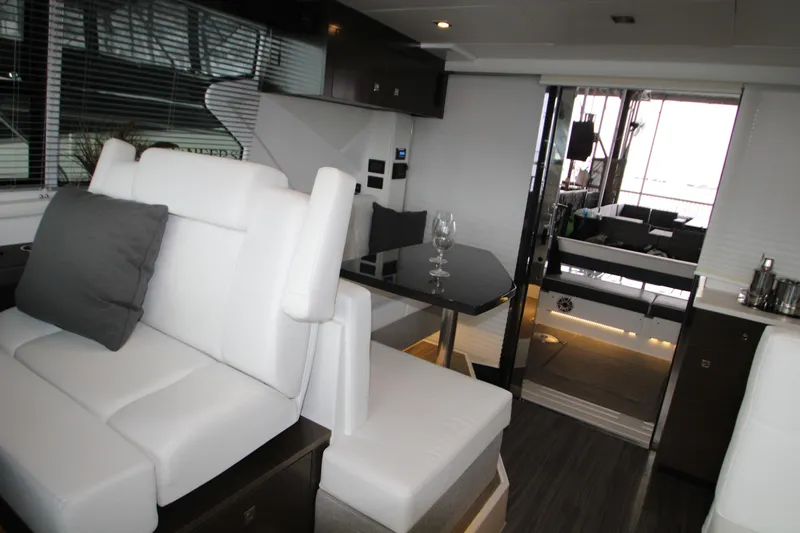 Slide: The Image of 2019 Cruisers Yachts 42 Cantius interior with modern seating and dining area. - 50