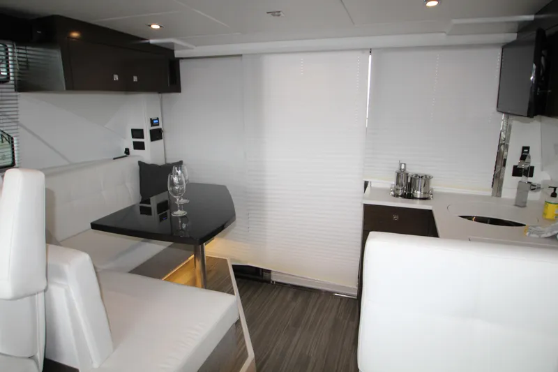 Slide: The Image of Luxurious interior of 2019 Cruisers Yachts 42 Cantius with modern dining area. - 51