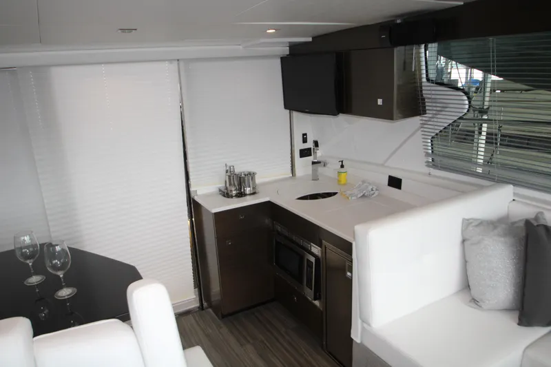 Slide: The Image of Interior of 2019 Cruisers Yachts 42 Cantius with modern kitchen and seating area. - 58