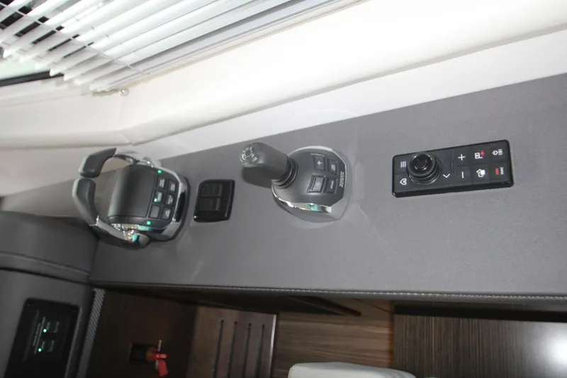 Slide: The Image of Control panel of 2019 Cruisers Yachts 42 Cantius with joystick and buttons. - 61