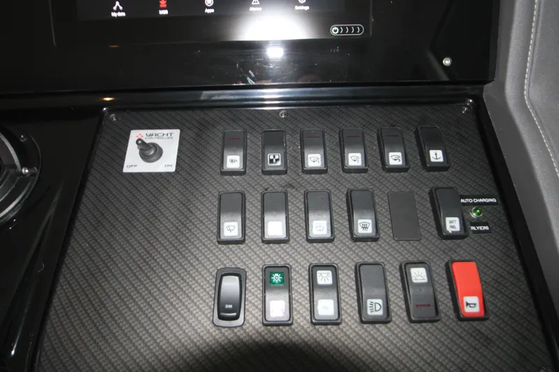 Slide: The Image of Control panel of 2019 Cruisers Yachts 42 Cantius with various switches and buttons. - 65