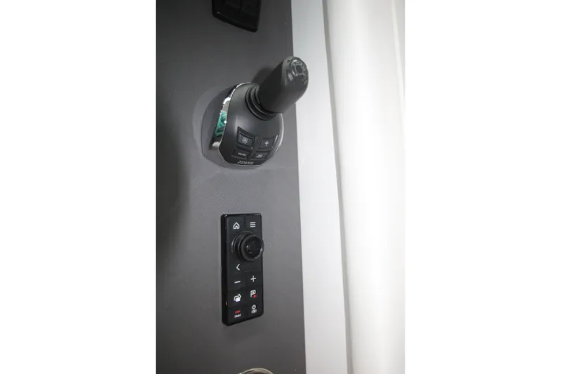 Slide: The Image of 2019 Cruisers Yachts 42 Cantius control panel with joystick and buttons. - 68