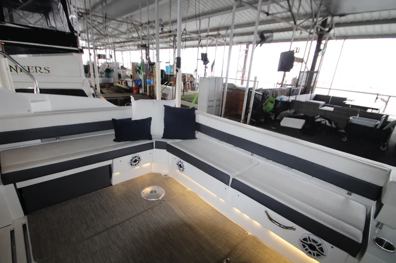 Slide: The Image of 2019 Cruisers Yachts 42 Cantius interior with cushioned seating and ambient lighting. - 72
