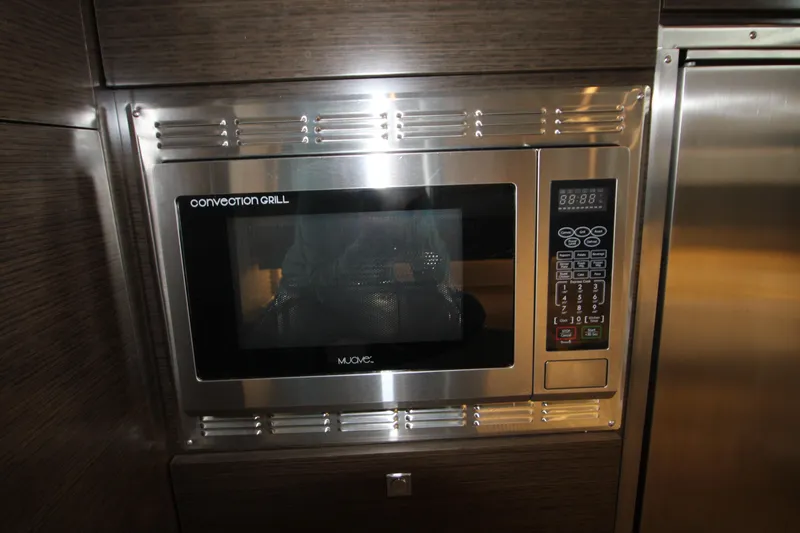 Slide: The Image of Convection grill microwave in 2019 Cruisers Yachts 42 Cantius kitchen area. - 78