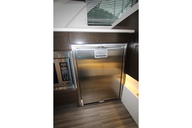 Slide: The Image of 2019 Cruisers Yachts 42 Cantius galley with stainless steel appliances. - 79