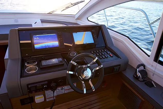 Slide: The Image of Luxurious interior of 2019 Cruisers Yachts 42 Cantius with elegant seating and table. - 8