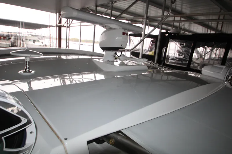 Slide: The Image of 2019 Cruisers Yachts 42 Cantius radar and antenna on deck under shelter. - 85