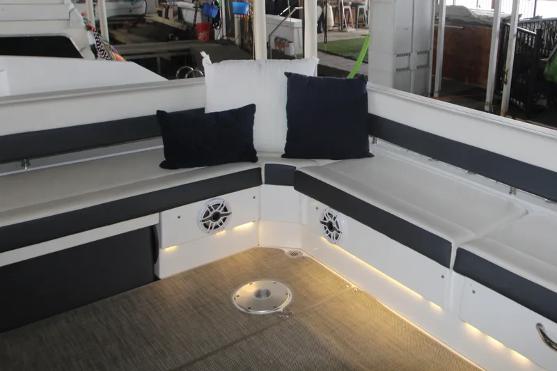 Slide: The Image of 2019 Cruisers Yachts 42 Cantius interior with cushioned seating and ambient lighting. - 86