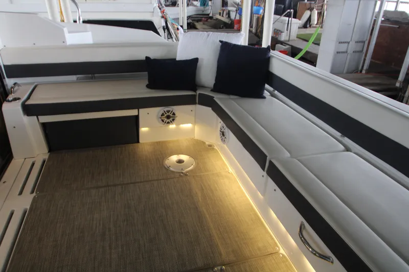 Slide: The Image of 2019 Cruisers Yachts 42 Cantius interior seating with cushions and ambient lighting. - 88
