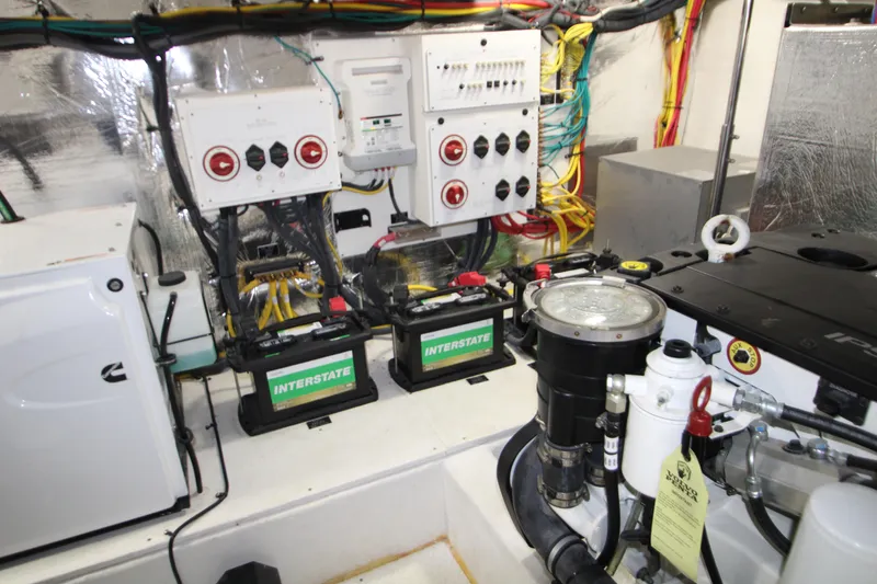 Slide: The Image of Engine room of 2019 Cruisers Yachts 42 Cantius with batteries and control panels. - 94