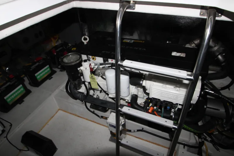 Slide: The Image of Engine room of 2019 Cruisers Yachts 42 Cantius with visible machinery and batteries. - 95