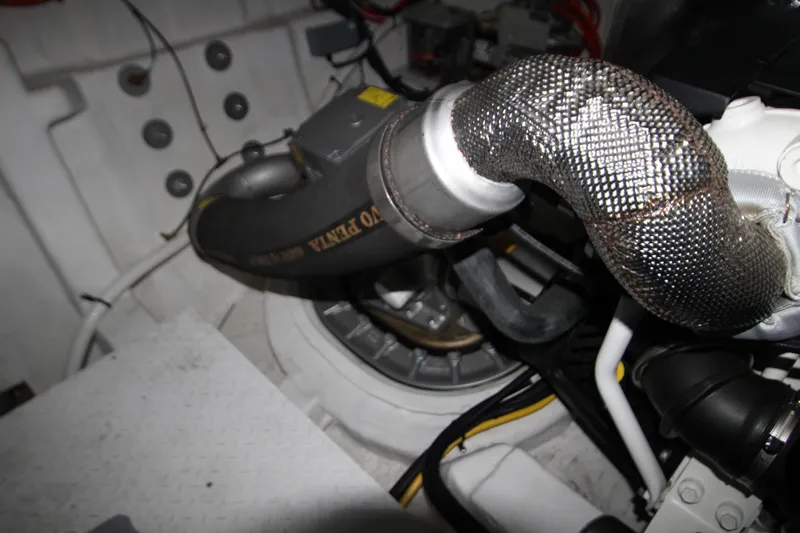 Slide: The Image of Engine compartment of 2019 Cruisers Yachts 42 Cantius, showing exhaust system details. - 98