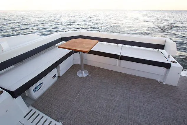 Slide: The Image of Manufacturer Provided Image: 2019 Cruisers Yachts 42 Cantius deck with seating and table, overlooking the water. - 114