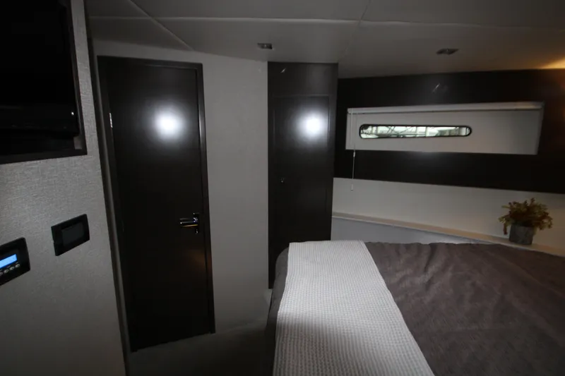 Slide: The Image of 2019 Cruisers Yachts 42 Cantius interior cabin with modern design and cozy bedding. - 22