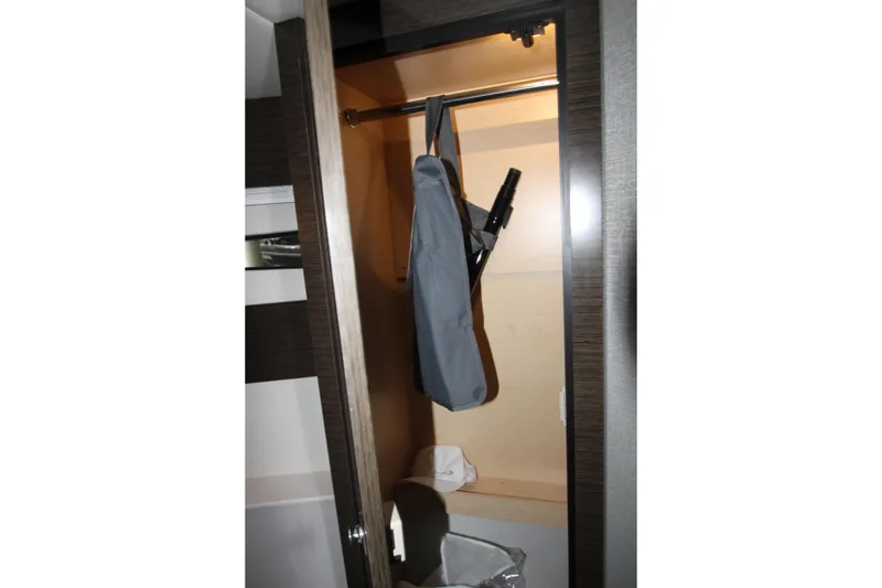 Slide: The Image of Closet interior on 2019 Cruisers Yachts 42 Cantius with hanging storage. - 24