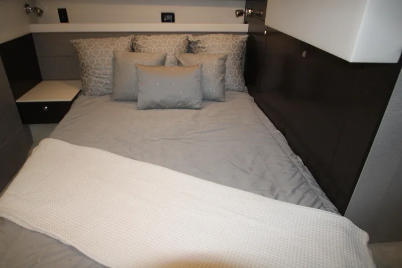 Slide: The Image of Luxurious bedroom interior of 2019 Cruisers Yachts 42 Cantius with elegant bedding. - 33