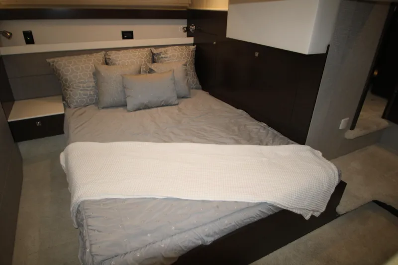 Slide: The Image of Luxurious bedroom interior of 2019 Cruisers Yachts 42 Cantius with elegant bedding. - 35