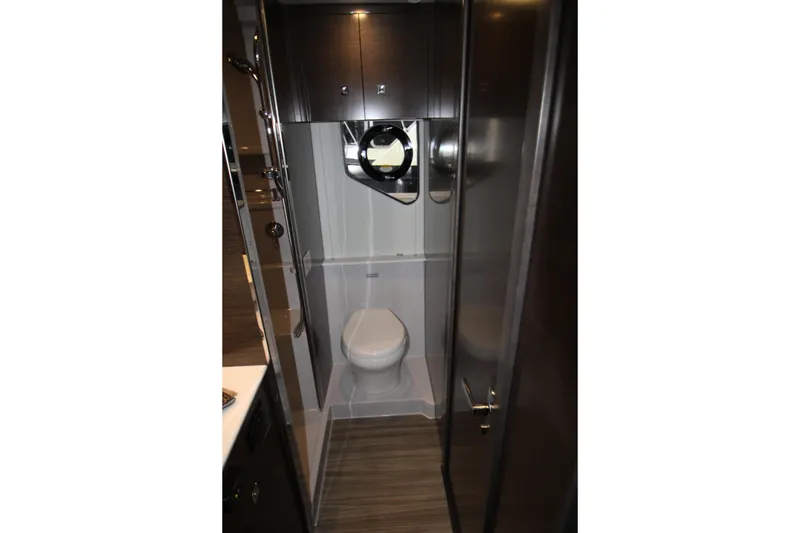 Slide: The Image of 2019 Cruisers Yachts 42 Cantius bathroom with modern fixtures and wood accents. - 42